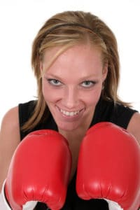 Business woman in boxing gloves.